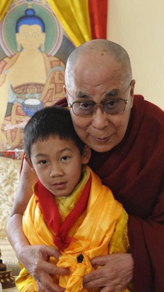 Dalai Lama With A Child Image